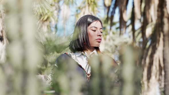 Pensive Young Native American Indian Girl Connected with Nature