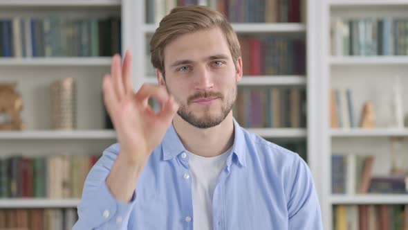 Portrait of Positive Man Showing OK Sign