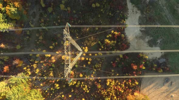 Aerial vertical overhead shot of power pylon carrying hydro electricity