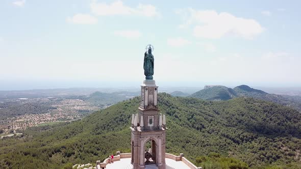 Aerial: The statue of Christ on the mountain of Saint Salvador in Mallorca, Spain