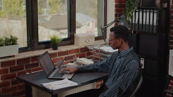 Worried Person Doing Financial Paperwork Under Pressure