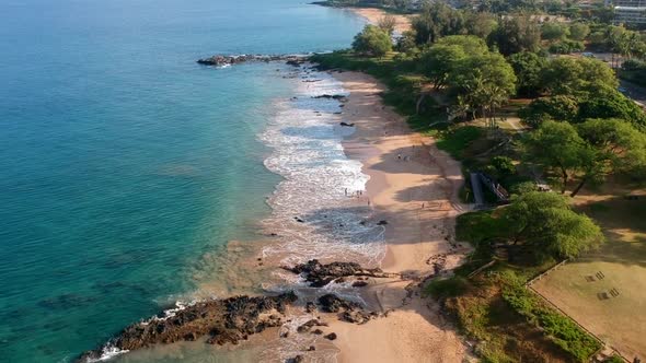 Aerial footage of Kamaole III beach park in the morning from the south side.  Maui, Hawaii