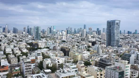 Tel Aviv, Israel skyline featuring key buildings and urban density on a sunny day with blue sky and