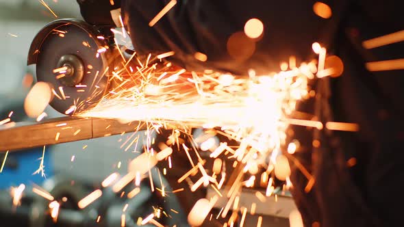 Industry Worker Grinding Metal with Angle Grinder