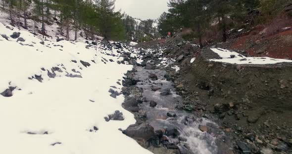 Drone shots of stream and small waterfalls created by melting snow in Troodos Mountain Cyprus.