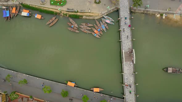 Aerial view of the river that cross the city and the boats in the small city Hot An, Vietnam