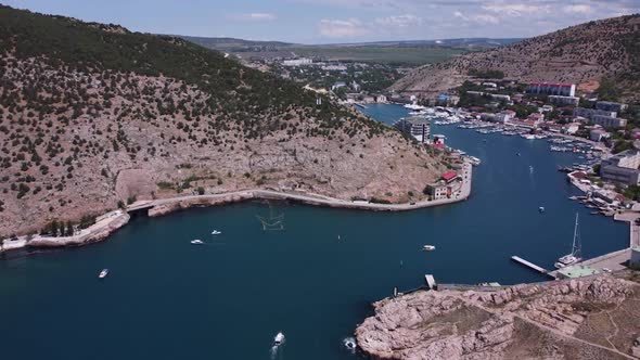 Aerial View of the Landscape with a Pier for Yachts and Boats on the Mediterranean Strait Between