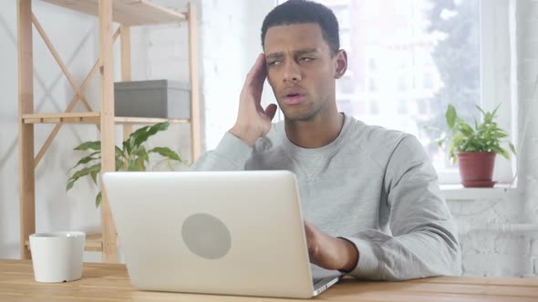 Tension and Headache Frustrated AfroAmerican Man with Stress