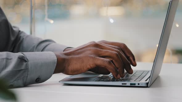 Closeup Male Hands African American Executive Businessman Typing on Laptop in Office Unrecognizable