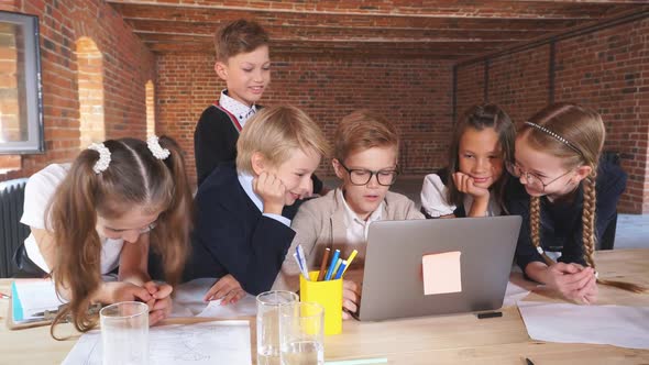 Serious Students Watching Online Lesson