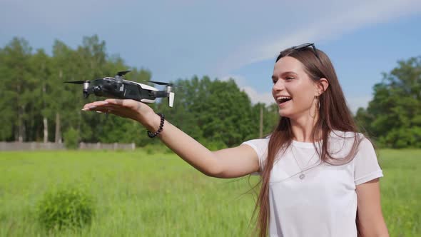 Beautiful Girl Catches a Drone in Her Palm