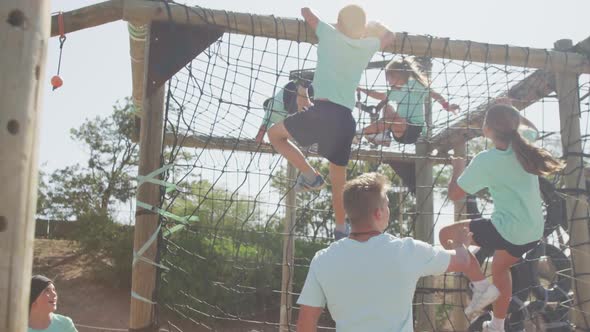 Group of Caucasian children training at boot camp