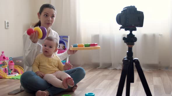Young Mother with Little Boy Recording Video on Camera and Vlogging About Family and Childhood