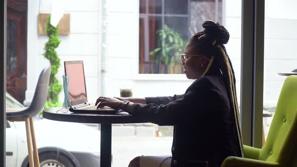 Young Business Woman Use Laptop Keyboard and Writing