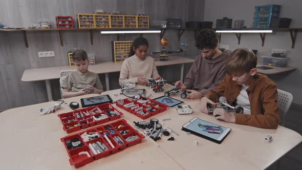 Ethnically Diverse Kids At Robotics Class alt