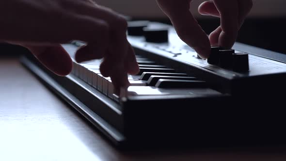 Musician Playing on Musical Keyboard