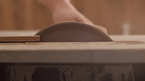 Sawing Ceramic Tiles on Machine By Men's Hands