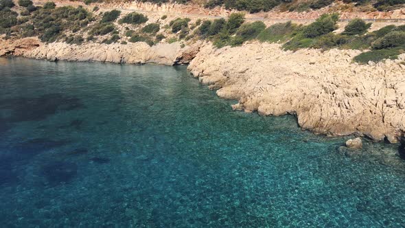 Empty turquoise beach with crystal clear blue water in Datca peninsula