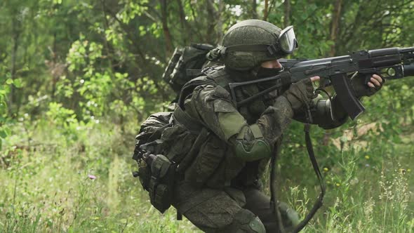 Special Forces Group in Camouflage with Assault Rifle Military Action in Forest Patrol Soldiers Go