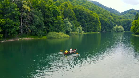 Young Couple in a Boat on the Biogradsko Lake in Montenegro