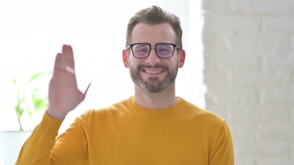 Portrait of Man Waving Welcoming