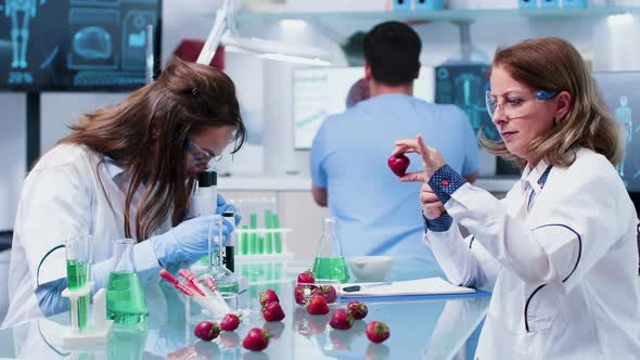 Female Scientist Injects GMO in Strawberries