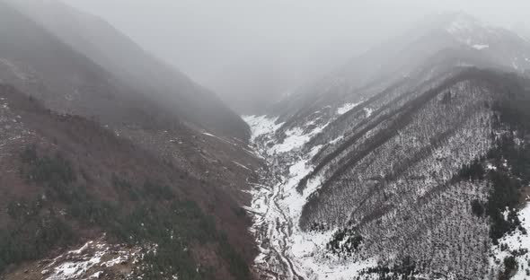 Aerial view of beautiful snowy mountains in Pasanauri, Georgia