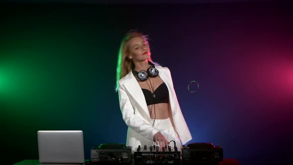 Beautiful Dj Girl in White Jacket, Headphones Playing Music and Dancing, Smoke