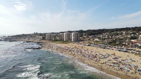 Drone view of some buildings on the beach in Chile