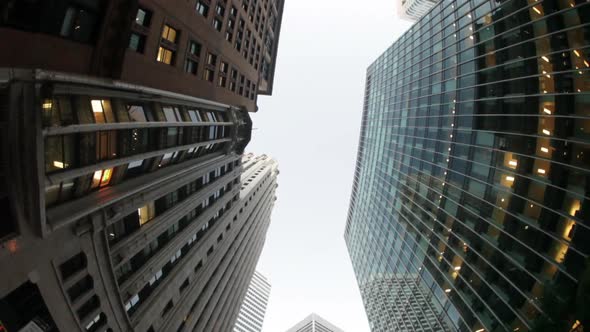 Upward fisheye view of skyscrapers while driving through San Francisco