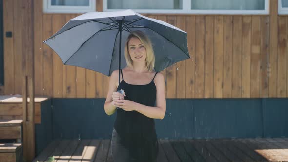 Attractive Blonde in the Summer Rain
