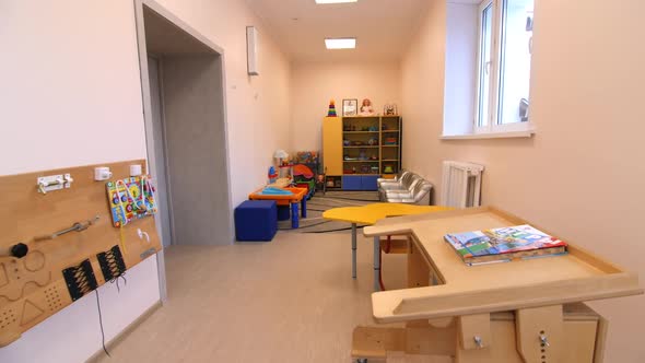 Comfortable Playroom with Toys and Children Furniture