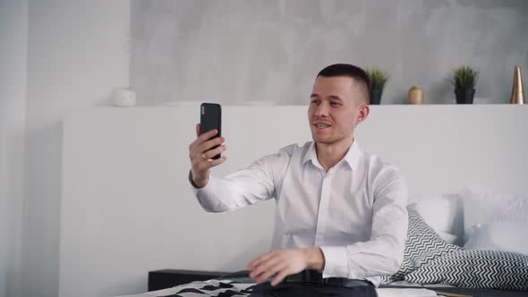 Handsome Man Speaking on Video Chat on Smart Phone