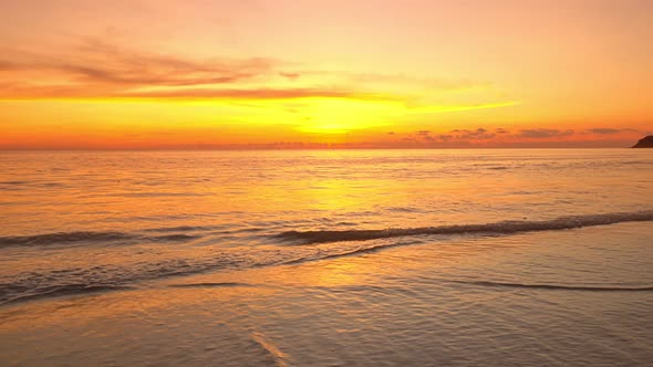 Tropical sea at sunset or sunrise over sea video 4K, The sun touches horizon, Red sky in golden hour