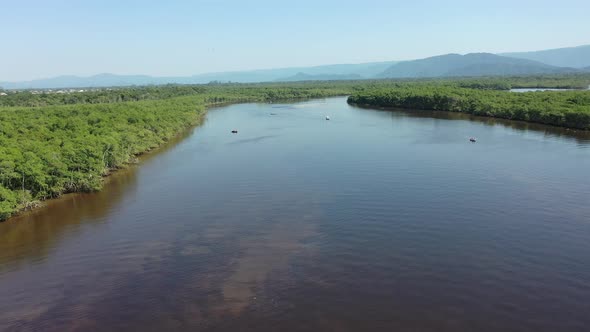 Peaceful dark river scene at coastal city of Itanhaem Sao Paulo Brazil.