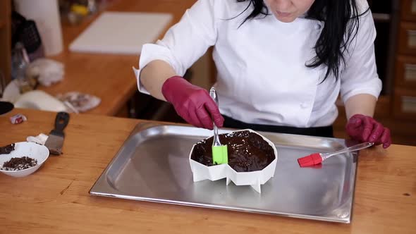 Professional Woman Confectioner is Making Chocolate Cake