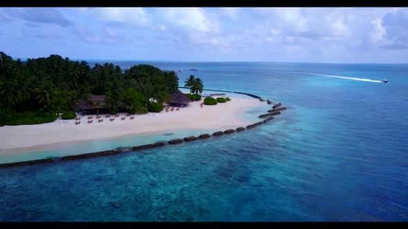 Aerial top view tourism of tranquil tourist beach break by shallow lagoon with white sand background