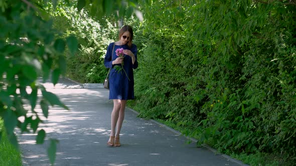 Young Woman Walking in the Park