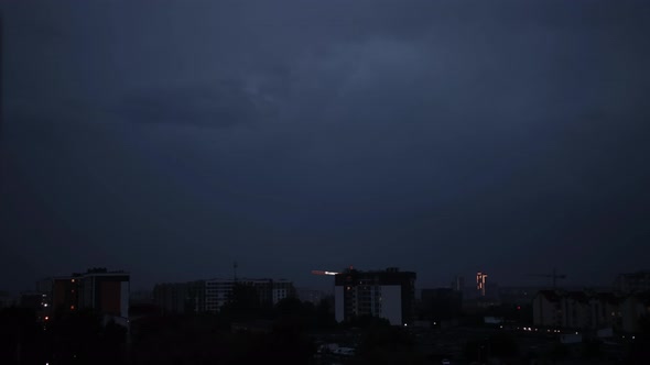 Lightning Bolts Flashes Composition with View of Night City Sky with Clouds