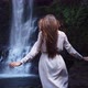 Young beautiful sexy woman in long white dress go to waterfall Tad Yuang, Laos Asia, Travel, 4K Slow - VideoHive Item for Sale