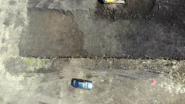 Aerial view of the construction site. Special machinery digs a pit.