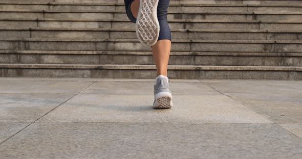 Fitness woman jumping rope in city