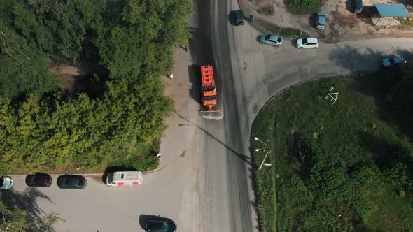 Big Orange Machine Clears the Asphalt with Water Streams