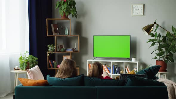 Women Watching Television with Chroma Green Screen