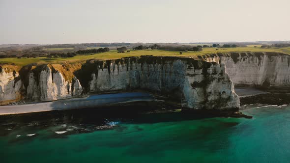 Idyllic Aerial Landscape View of Sunset Azure Sea Shore and Famous Normandy White Rocky Cliffs 