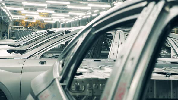 Bodies of Unfinished Cars Held in a Factory Unit