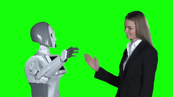 Hand of a Woman and a Robot Hand Give Five . Green Screen. Slow Motion