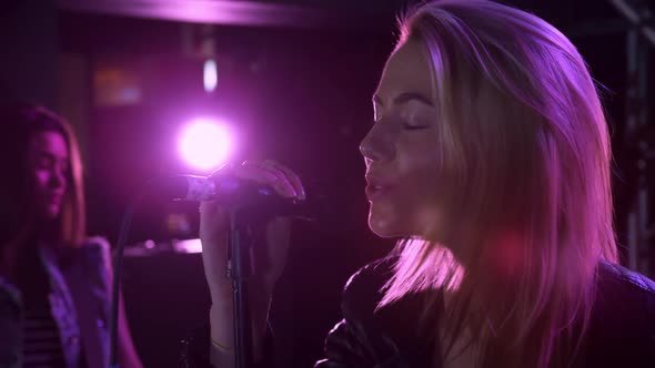 Female musician singing during a concert