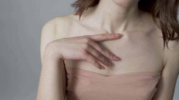 The Shoulder of a Young Woman