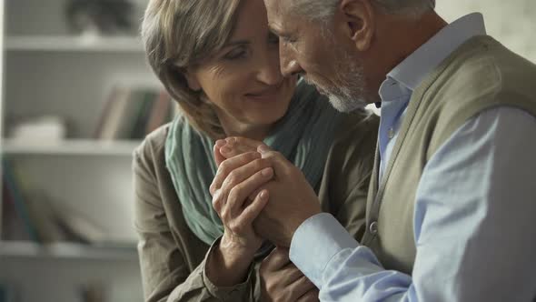 Happy Senior Couple Sitting Together Man Kissing Woman Hand, Successful Marriage